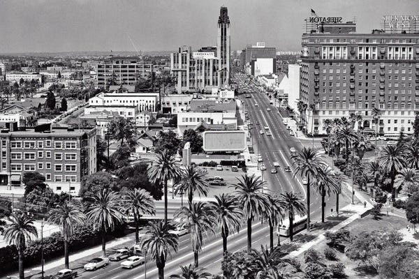 Los Angeles: 1960s Aerial Of Wilshire Boulevard Look Across Lafayette Park To Shopping District Sheraton Hotel Palm Trees Los Angeles Ca USA by Vintage Images