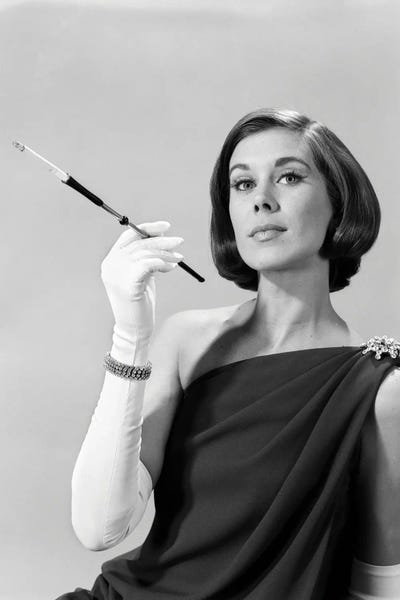 1960s Formally Elegantly Dressed Young Woman Arrogant Expression Holding Long Cigarette Holder Wearing Long White Gloves by Vintage Images acrylic art print
