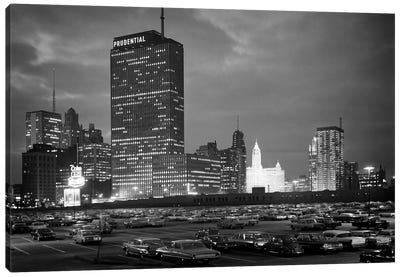 1960s Night Skyline Of Prudential Building And Brightly Lit Wrigley Building From Monroe Drive Chicago Illinois USA Canvas Art Print - Vintage Images