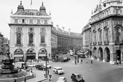 1960s Pedestrians And Cars Moving Around Piccadilly Circus 1819 With A View To The Regent Street Quadrant London England by Vintage Images canvas print