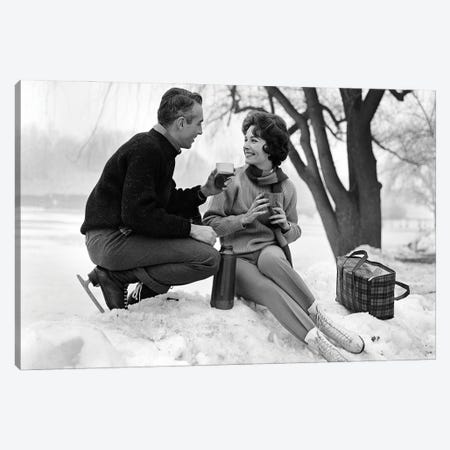 1960s Smiling Couple In Snow Wearing Ice Skates Drinking Hot Beverage From Thermos Canvas Print #VTG822} by Vintage Images Canvas Art