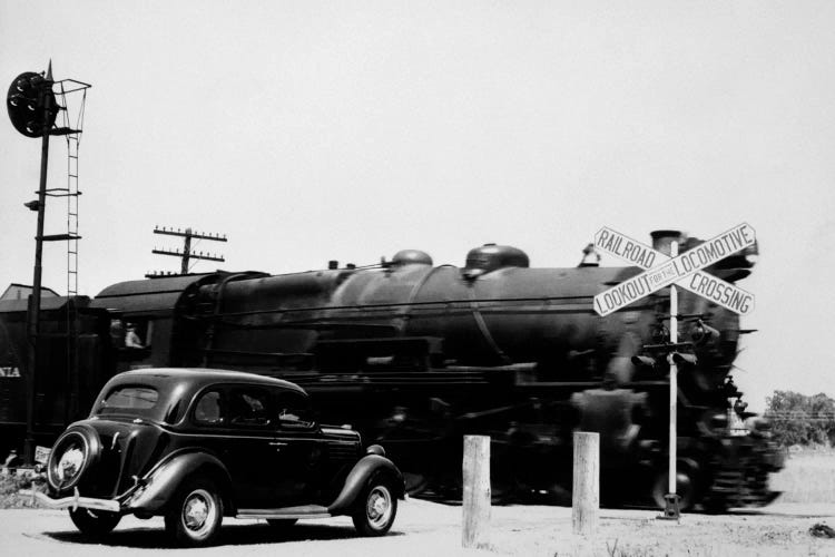 1930s Automobile Stopped At Railroad Grade Crossing With Steam Engine Speeding By