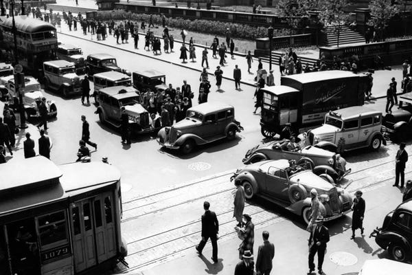 1930s Busy Intersection Fifth Avenue And 42nd Street With Traffic Jam & Many Pedestrians New York City USA