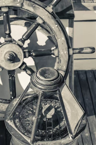 Sepia Photography: USA, Massachusetts, Cape Ann, Gloucester, schooner marine compass and ship's wheel by Walter Bibikow