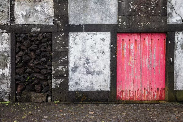 Doors: Portugal, Azores, Pico Island, Porto Cachorro. Old fishing community set in volcanic rock buildings by Walter Bibikow