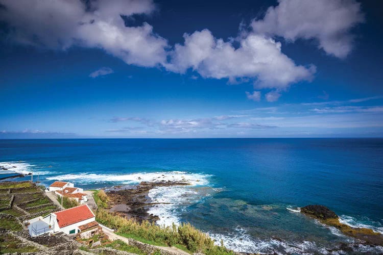 Portugal, Azores, Santa Maria Island, Maia. Elevated view of town and volcanic rock vineyards