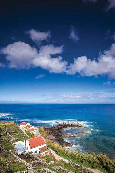 Portugal, Azores, Santa Maria Island, Maia. Elevated view of town and volcanic rock vineyards