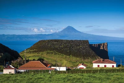 Portugal, Azores, Sao Jorge Island. Baia dos Arraias, view towards Pico Volcano by Walter Bibikow art print