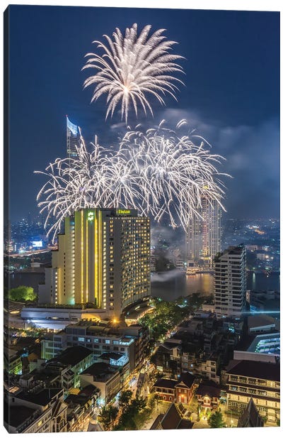 Thailand, Bangkok. Riverside, high angle skyline view with fireworks at dusk. Canvas Art Print - Walter Bibikow