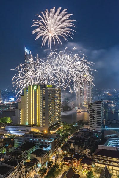 Walter Bibikow: Thailand, Bangkok. Riverside, high angle skyline view with fireworks at dusk. by Walter Bibikow