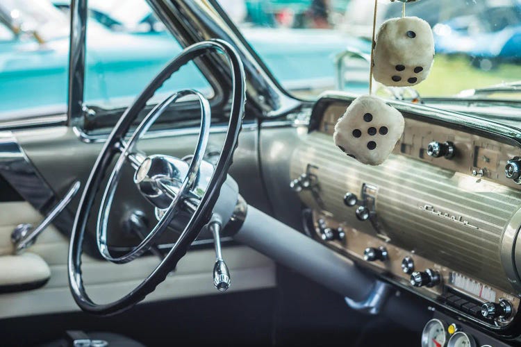USA, Massachusetts, Cape Ann, Gloucester. Antique car, antique car steering wheel and fuzzy dice