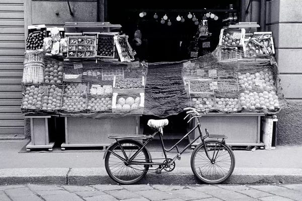 Bicycles: Bicycle And Fruit Stand, Milan, Lombardy Region, Italy by Walter Bibikow