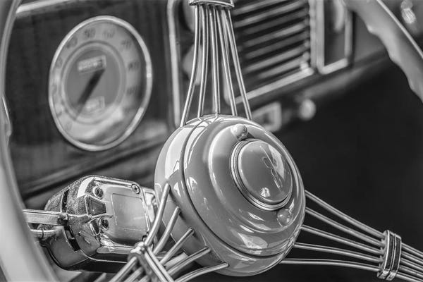USA, Massachusetts, Essex. Interior detail of antique cars, 1940's-era steering wheel.