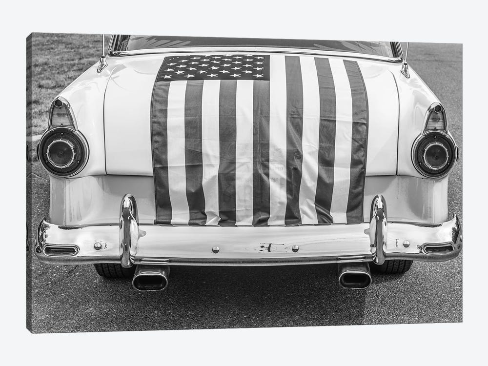 USA, Massachusetts, Essex. Antique cars, detail of 1950's-era Ford draped with US flag. by Walter Bibikow 1-piece Canvas Artwork