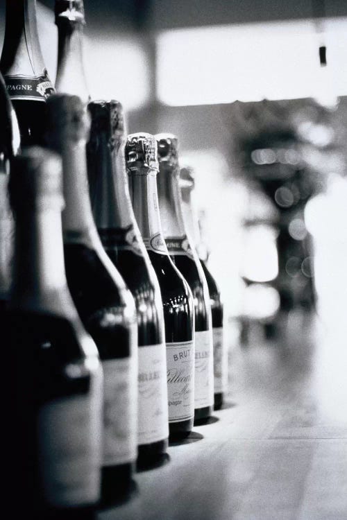 A Row Of Champagne Bottles