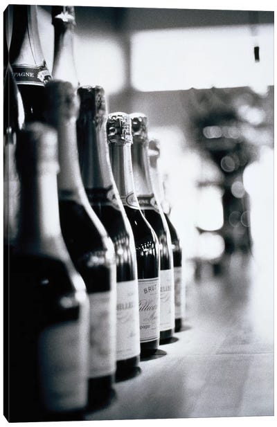 A Row Of Champagne Bottles Canvas Art Print - Winery/Tavern