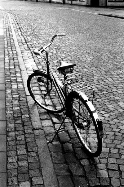 Walter Bibikow: Vintage Bicycle On A Stone Street In B&W by Walter Bibikow