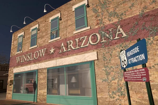 Masonry: U.S. Route 66 Standin' On The Corner Park Roadside Attraction, Winslow, Arizona, USA by Walter Bibikow