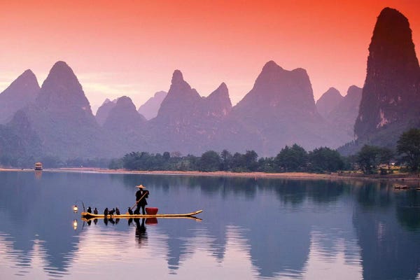 China: A Lone Fisherman, Li River, Guangxi Zhuang Autonomous Region, People's Republic Of China by Walter Bibikow