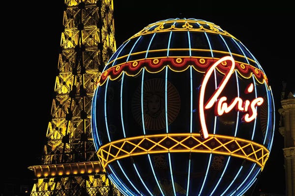Signs: Neon Montgolfier Balloon And Eiffel Tower Statues, Paris Las Vegas, Paradise, Nevada, USA by Walter Bibikow