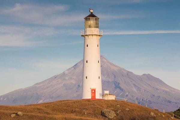 Walter Bibikow: New Zealand, North Island, Pungarehu. Cape Egmont Lighthouse and Mt. Taranaki II by Walter Bibikow