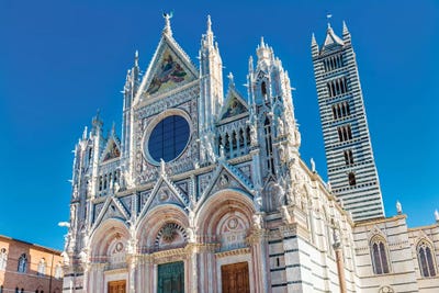 Facade Of Towers Mosaics Cathedral, Siena, Italy. Cathedral Completed From 1215 To 1263. by William Perry framed canvas print