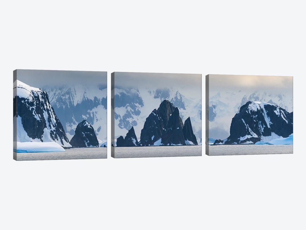 Antarctic Peninsula, Antarctica, Spert Island. Craggy Rocks And Mountains. by Yuri Choufour 3-piece Canvas Print