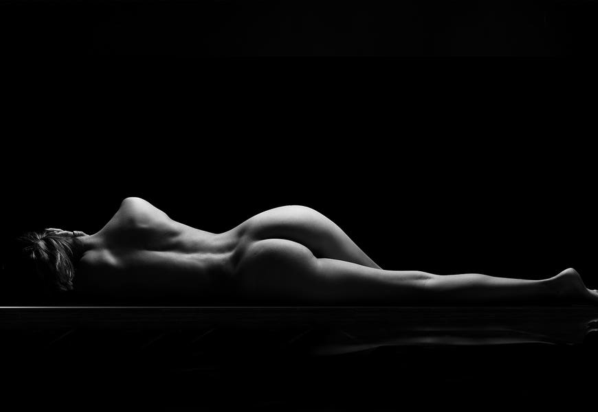 Nude Laying Down Woman Naked Sensual On Black Background XI by Alessandro Della Torre