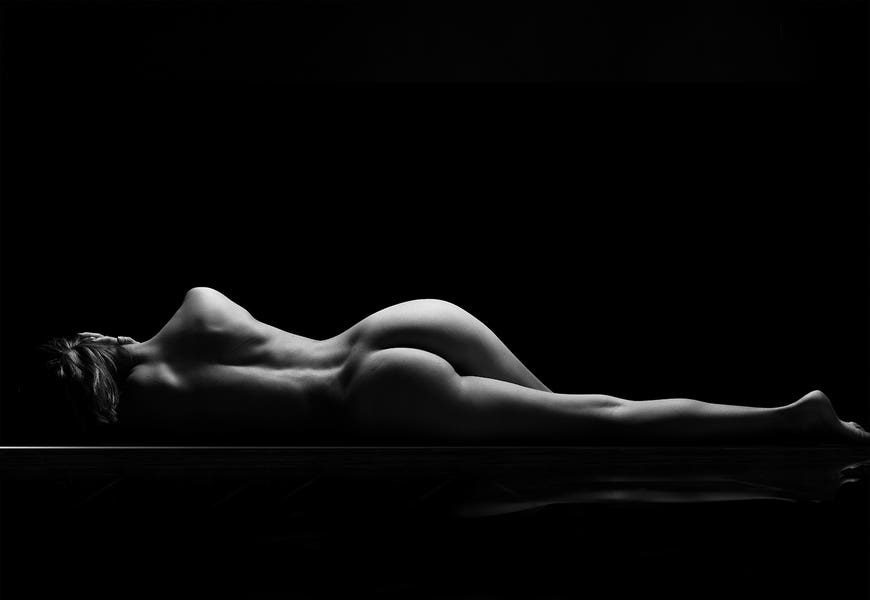 Nude Laying Down Woman Naked Sensual On Black Background XI by Alessandro Della Torre