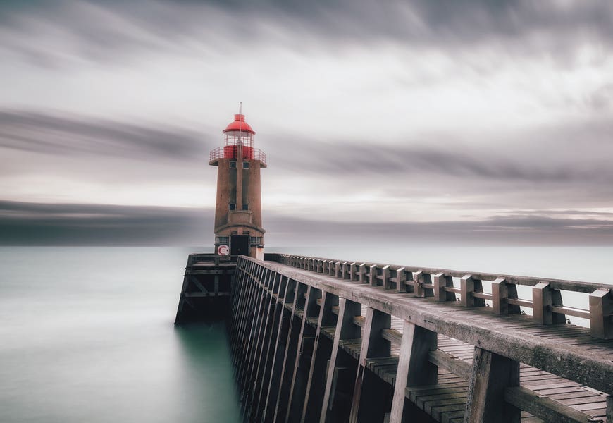 A Lighthouse At The Port by Karim Carella