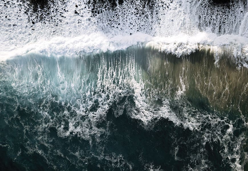 Oceanscape With Waves Coming Onto A Black Beach by Michael Schauer