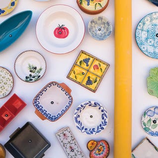 Colorful Plates At Wall by Gilliard Bressan