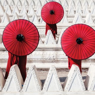 Three Novices with Red Umbrellas by Zay Yar Lin