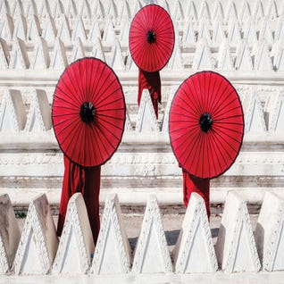 Three Novices with Red Umbrellas by Zay Yar Lin